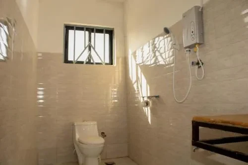 En-suite bathroom with a hot shower